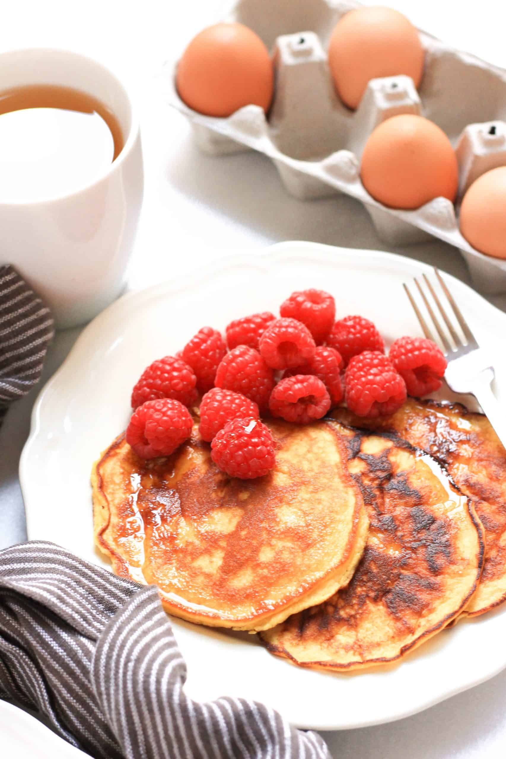 Close up of paleo coconut flour pancakes on a plate.