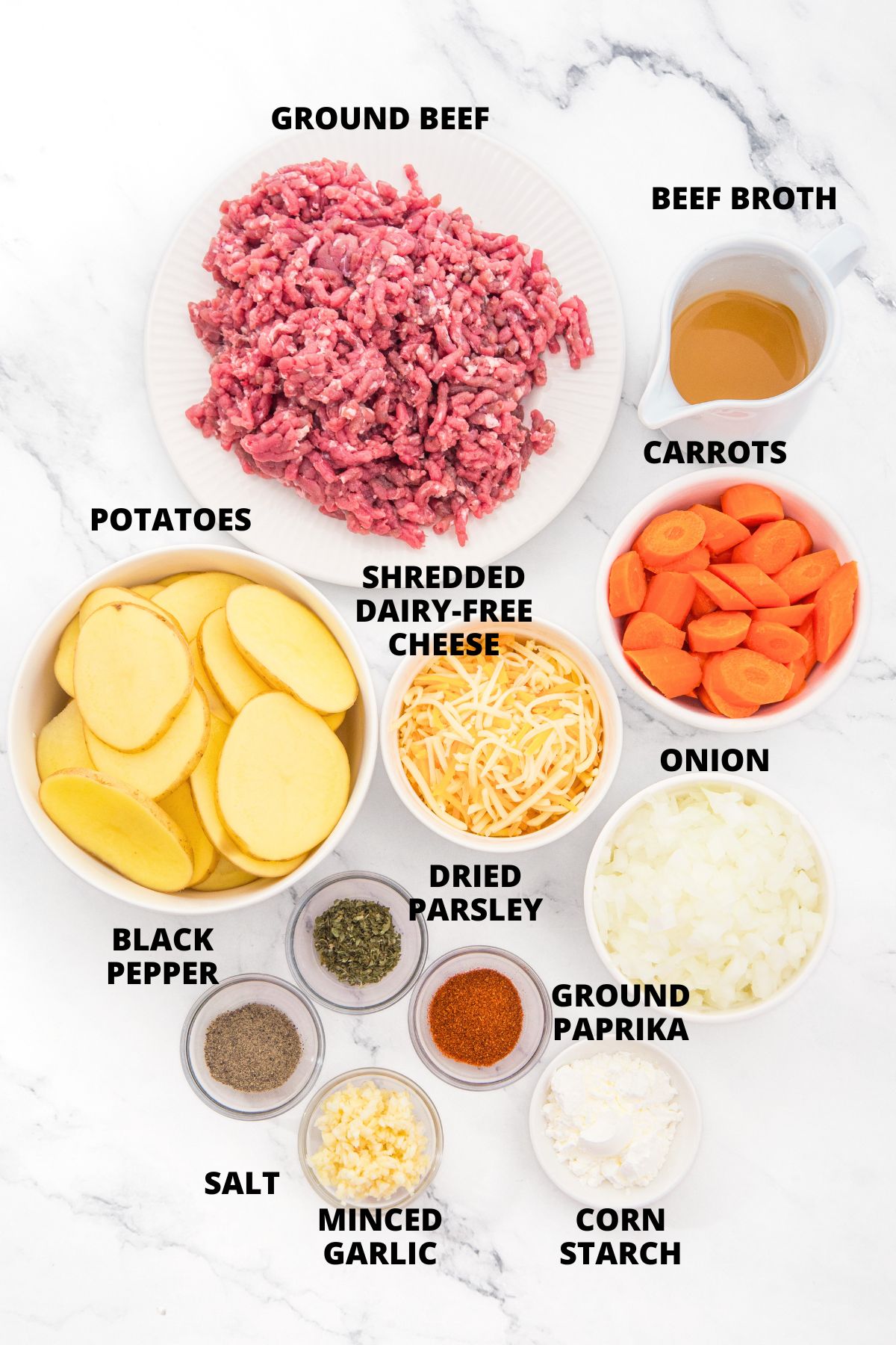 Slow Cooker Ground Beef and Potato Casserole Recipe (Gluten-Free, Dairy-Free) Ingredients for slow cooker beef and potato casserole recipe laid out on marble board