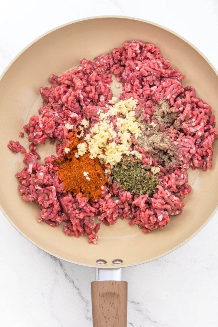 Skillet with ground beef and condiments
