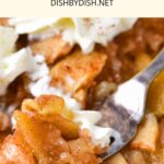 Holding a forkful of baked apple slices