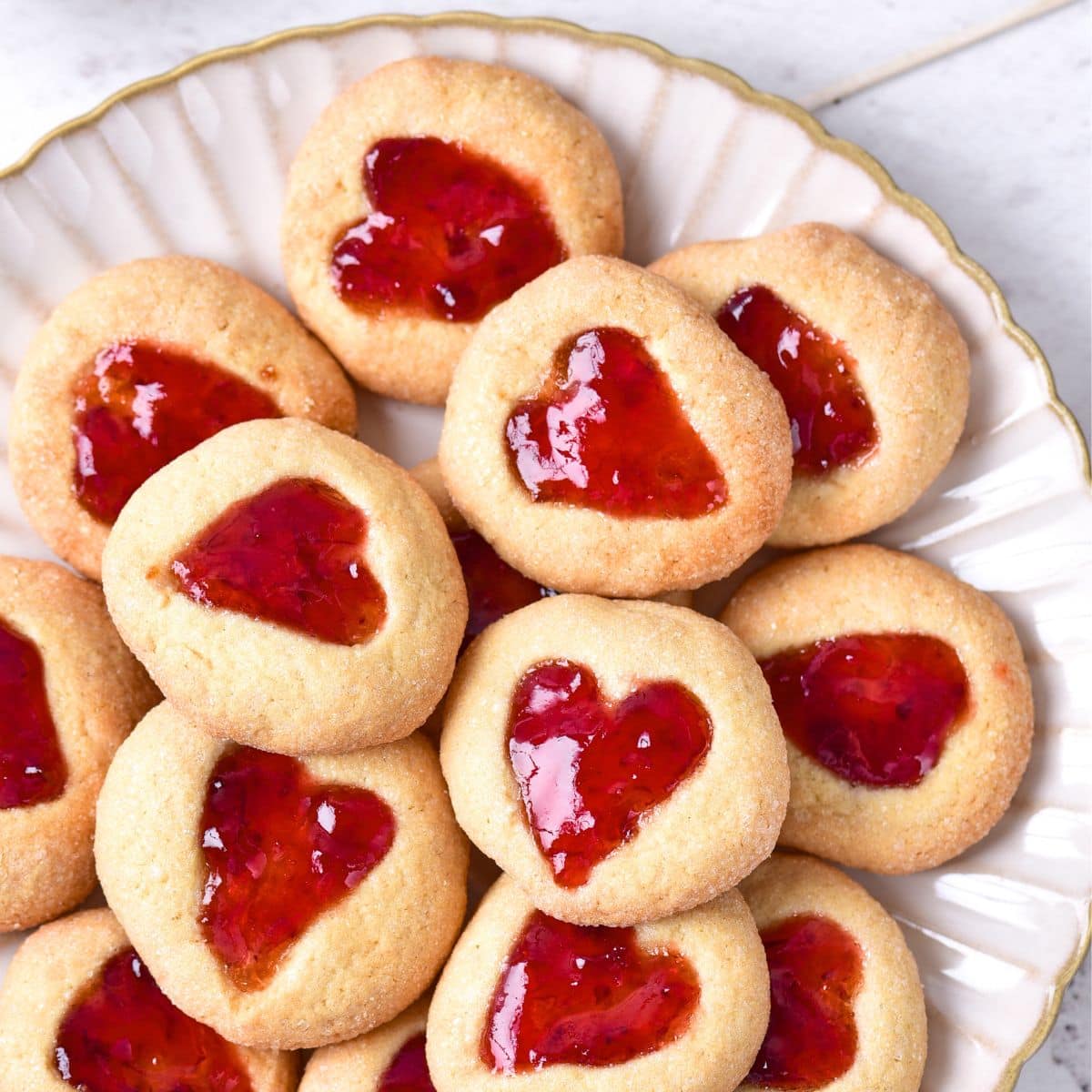 A plate of heart-jam cookies