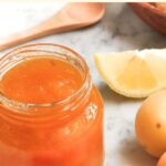 Up close view of a jar of apricot jam