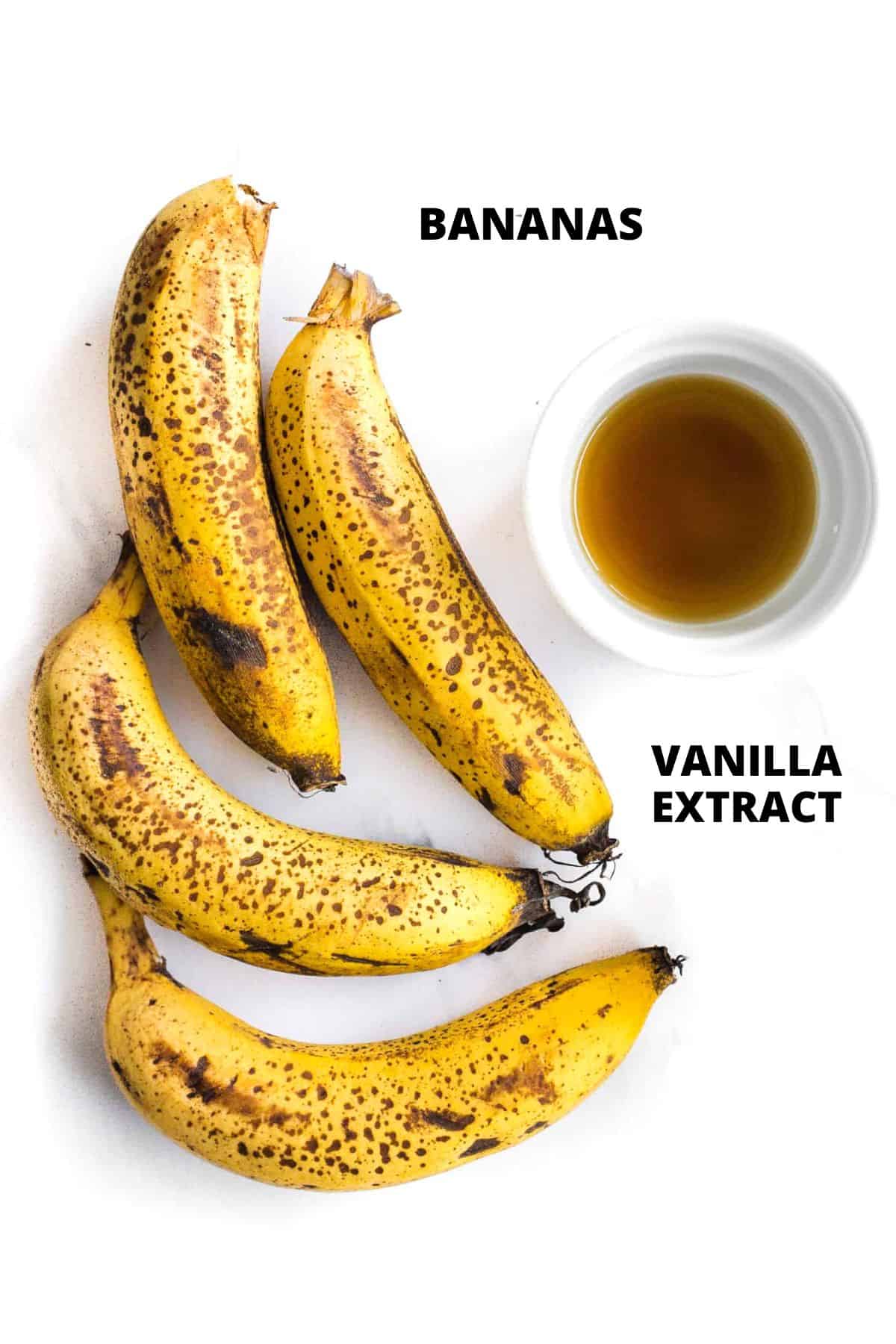 Ingredients for making homemade banana ice cream laid out on marble board.