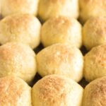 Gluten-free dinner rolls in glass baking pan.