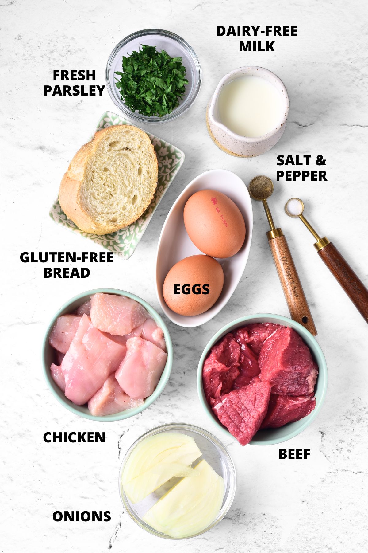 Ingredients for gluten-free burgers recipe laid out on marble board.
