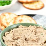 A bowl of duck liver pate and crackers