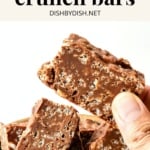 Holding up a homemade peanut butter crunch bar.