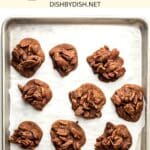 Homemade pralines on parchment-lined baking sheet.