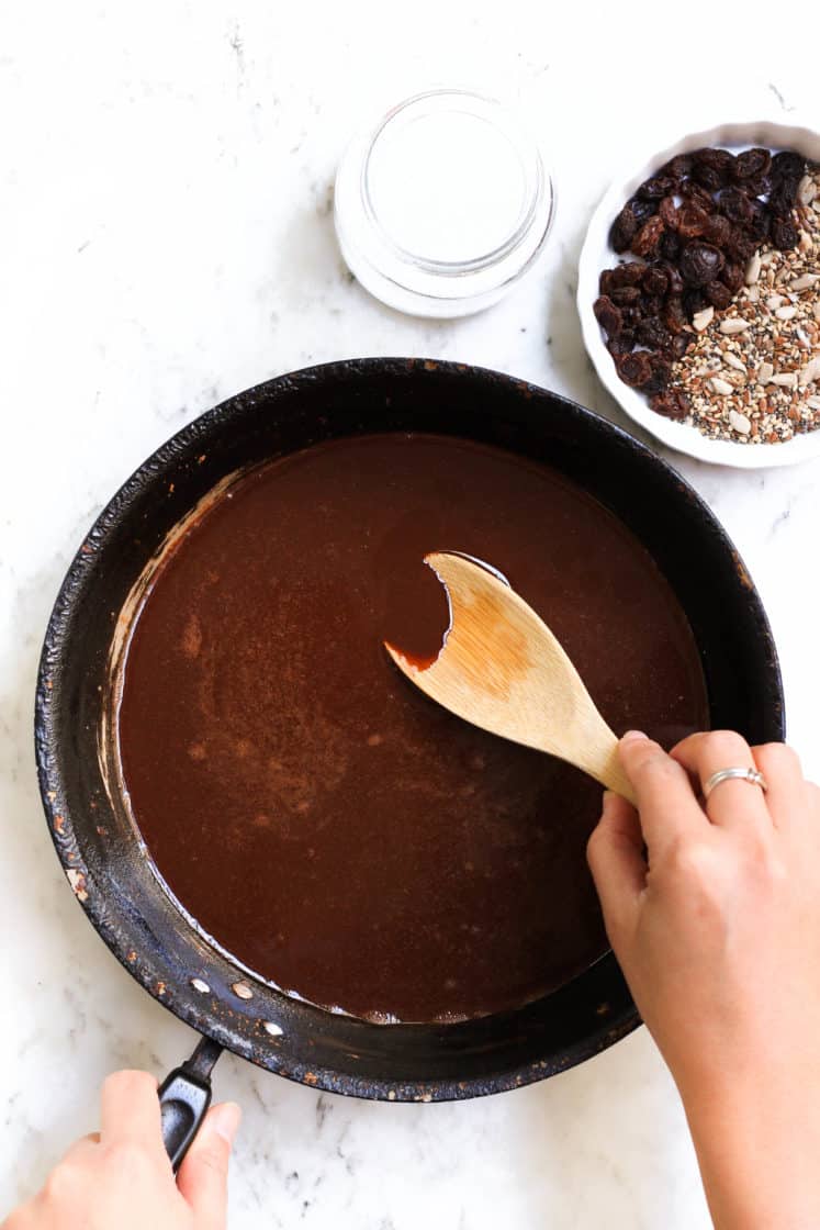 Stirring chocolate mixture in a pan.