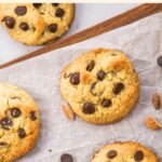 Top down view of chocolate chip almond flour cookies on parchment-lined board.