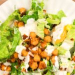Top down view of salad topped with chickpeas
