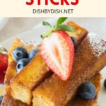 French toast sticks piled on a plate.