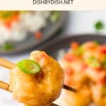 Using chopsticks to hold up a shrimp