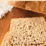 Top down view of slices of beer bread on wooden board.