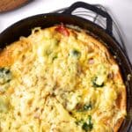Top down view of gluten-free frittata in cast iron skillet.