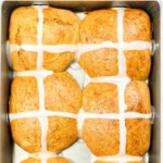 Freshly baked hot cross buns in metal baking pan.