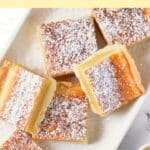Top down view of gluten-free lemon bars on white plate.
