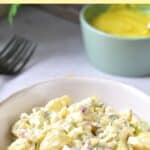 Bowl of potato salad on yellow cloth