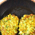 Cooking gluten-free zucchini fritters in a skillet