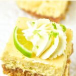 Up close view of gluten-free key lime bars topped with whipped cream