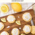 Top down view of ricotta lemon cookies on wooden board.