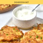 Gluten-free potato latkes and a bowl of sour cream.