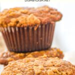 Pumpkin spice banana muffins on wooden board.
