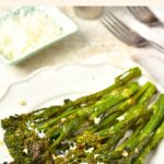 A plate of roasted broccolini with garlic