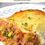 A plate of shepherd's pie on a board.