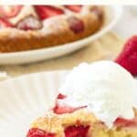 A slice of strawberry cake on plate.