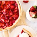Top down view of a slice of strawberry pie on plate.