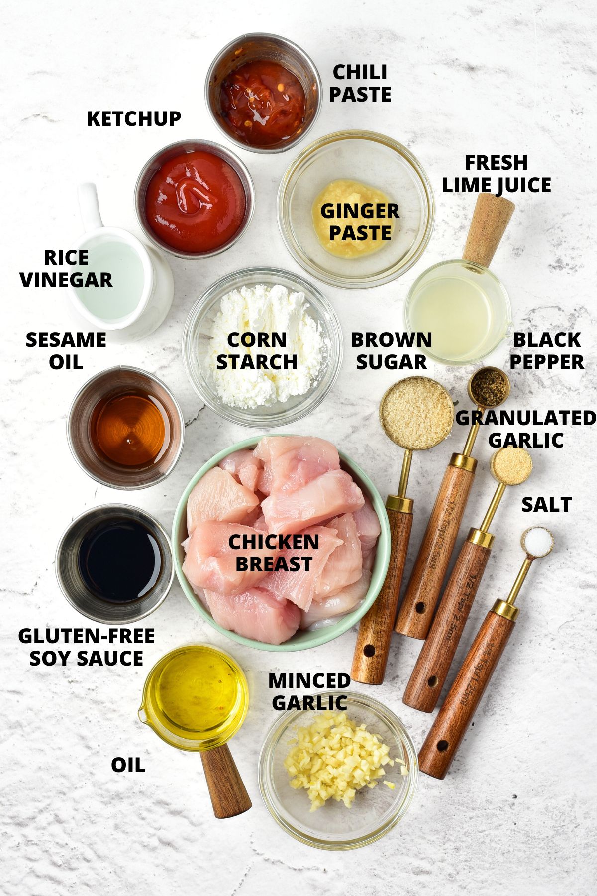 Ingredients for Korean fried chicken recipe laid out on marble board.