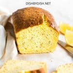 Sliced loaf of lemon poppy seed cake.