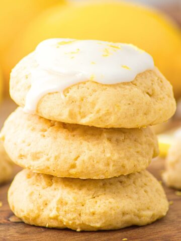A stack of ricotta lemon cookies topped with icing.