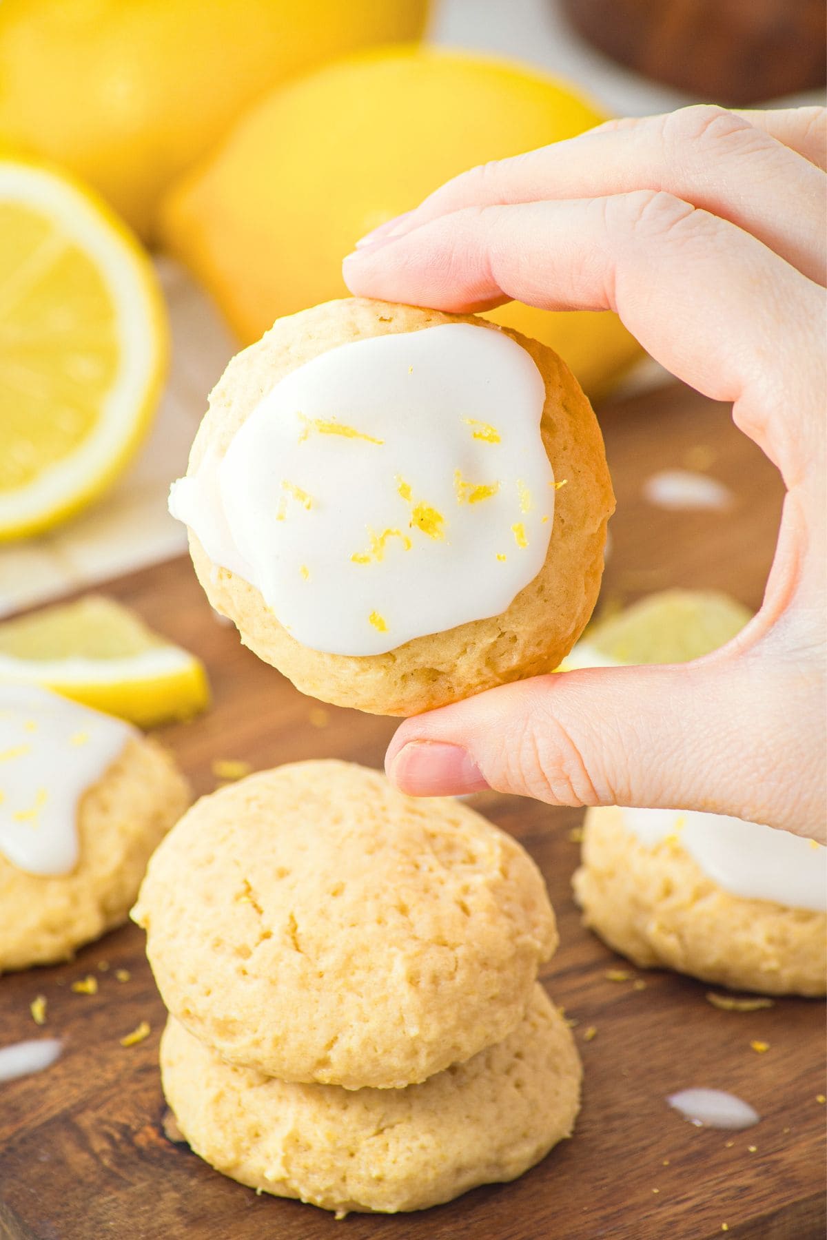 Hand holding up a gluten-free lemon ricotta cookie
