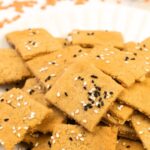 A plate of red lentil crackers
