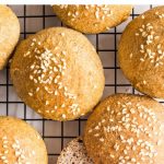 Hand reaching for a sliced bun