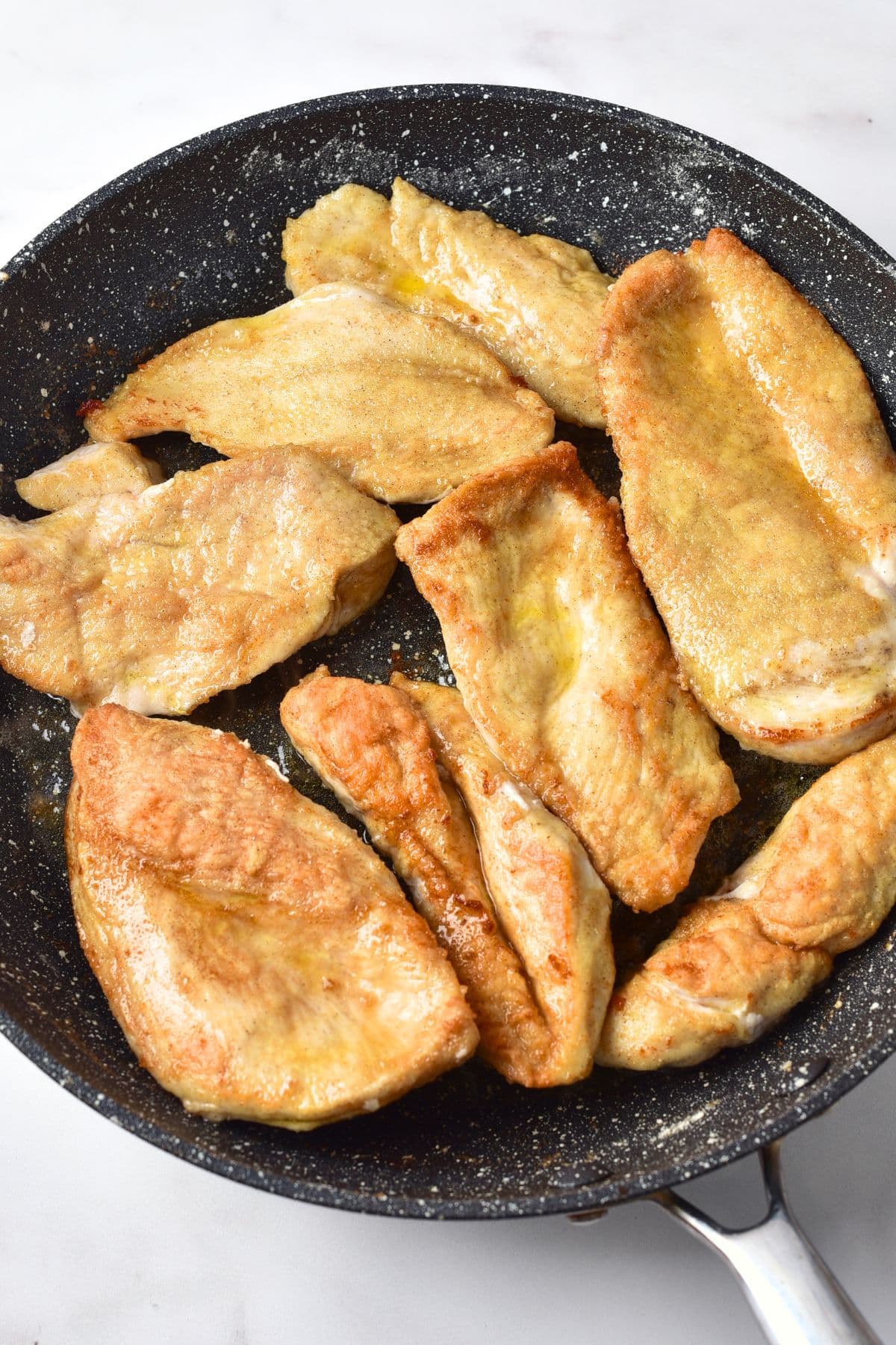 Searing chicken breasts in skillet