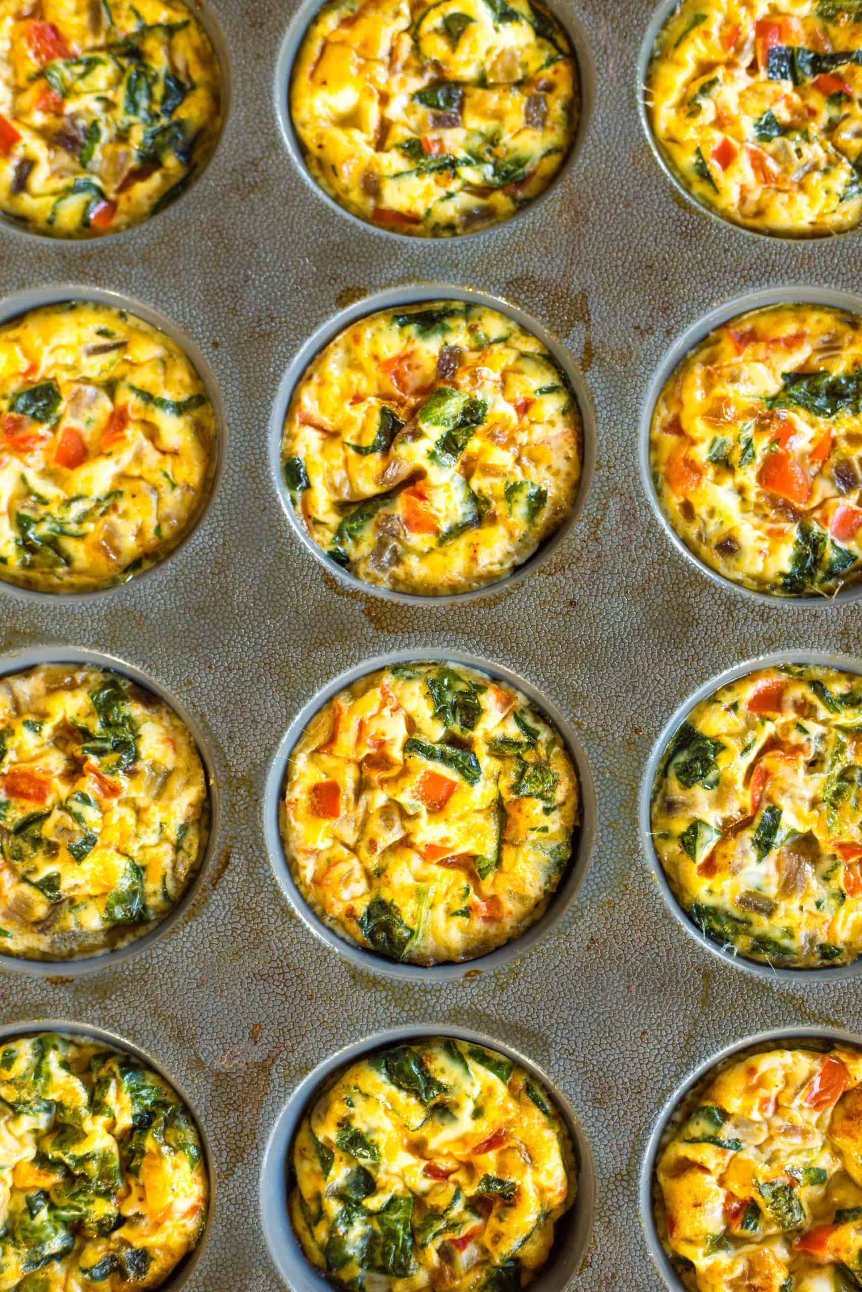 Freshly baked mini crustless quiches in silicon muffin mold.