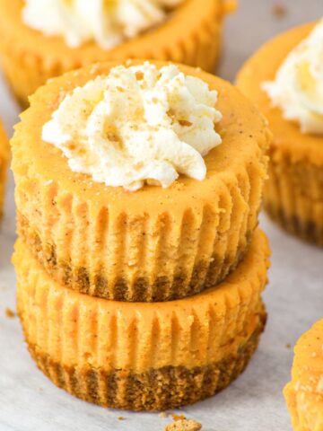 Mini pumpkin cheesecakes stacked on top of each other