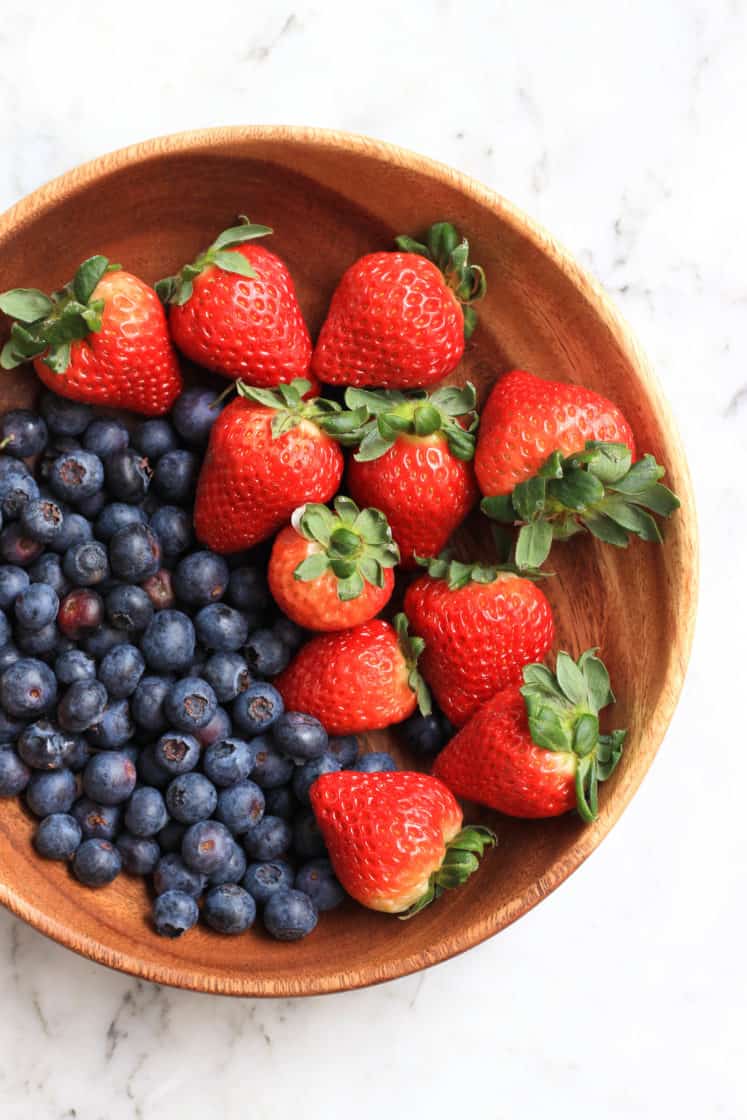 A wooden bowl with fresh berries