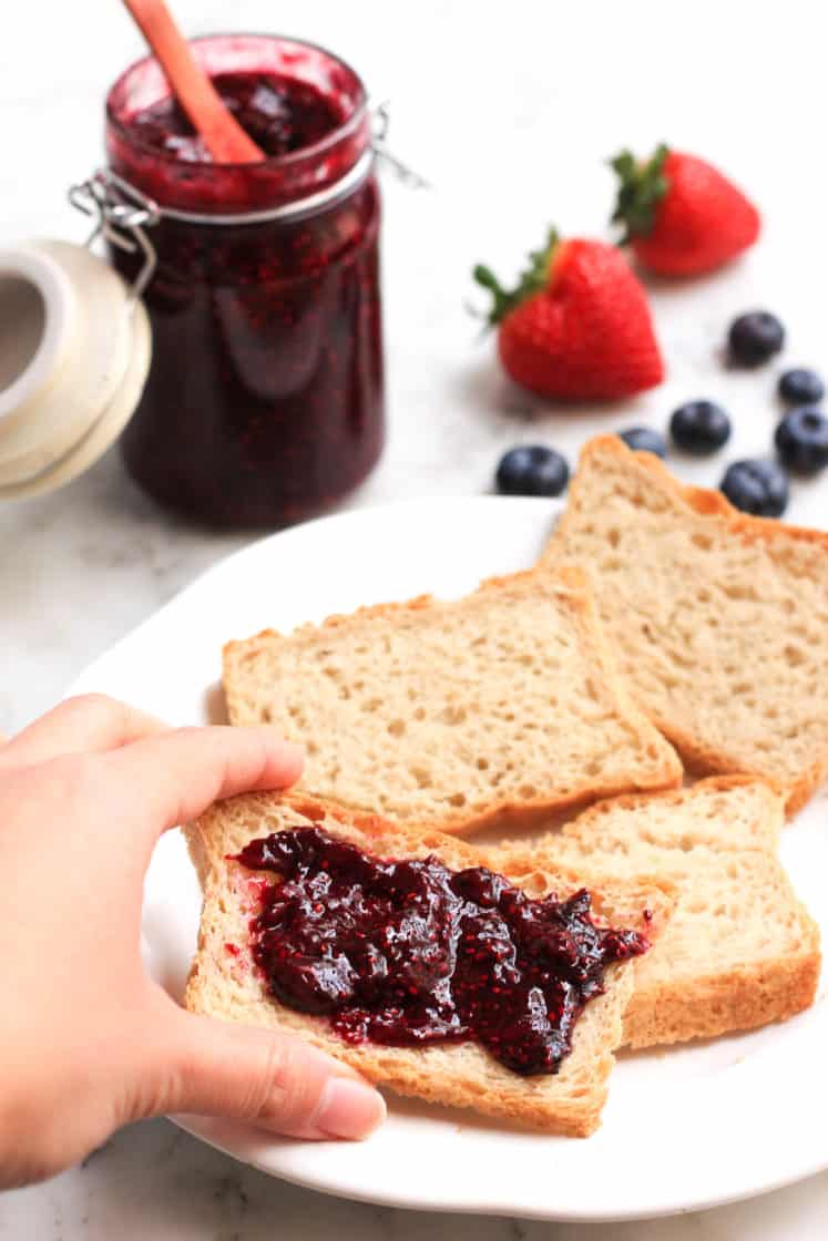 Reaching for a slice of bread spread with chia seed jam