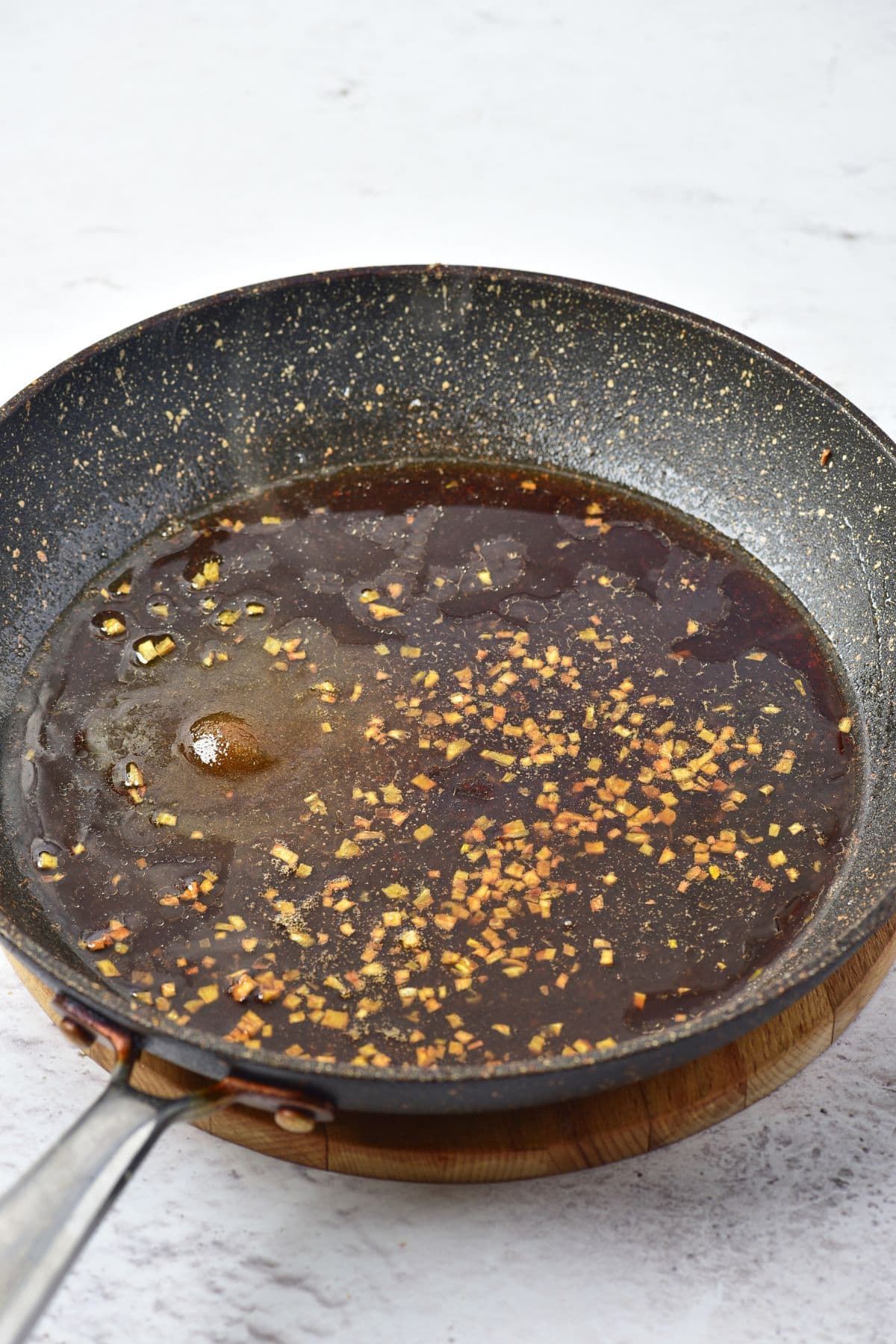 Preparing brown sauce in a skillet