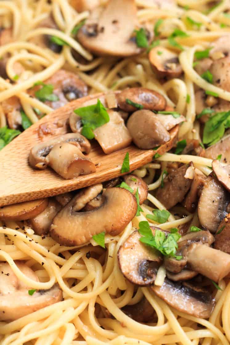 Up close shot of mushrooms and spaghetti.