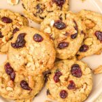 Top down view of a plate of oatmeal cranberry cookies