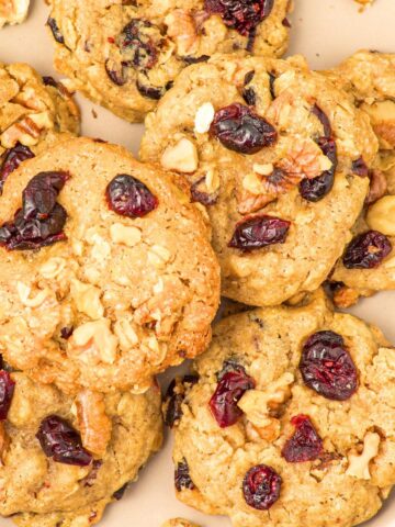 Top down view of a plate of oatmeal cranberry cookies