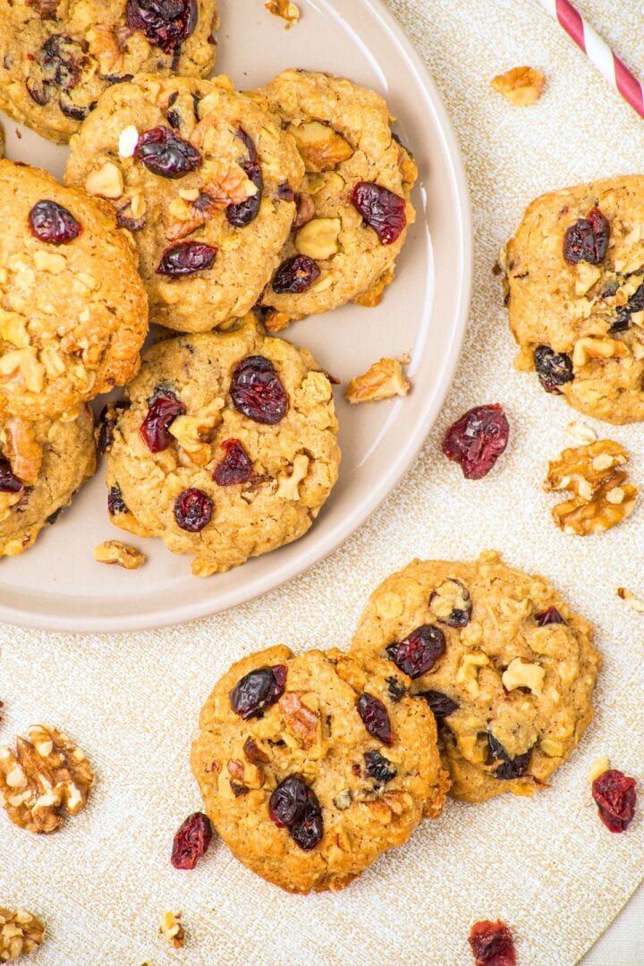 Top down view of a plate of oatmeal and cranberry cookies.