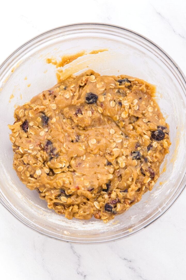 Oatmeal cookie dough in glass bowl.