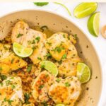 Top down view of cilantro lime chicken thighs in skillet
