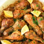 Top down view of chicken legs in baking dish